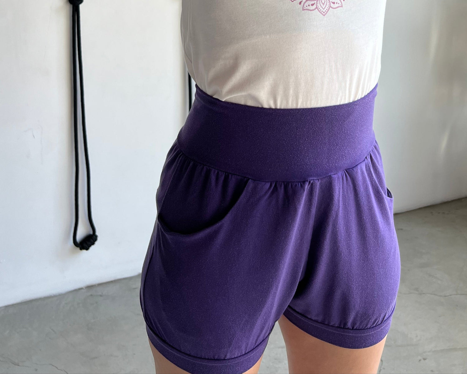 woman wearing Ame yoga shorts with pockets that are made of sustainable materials
